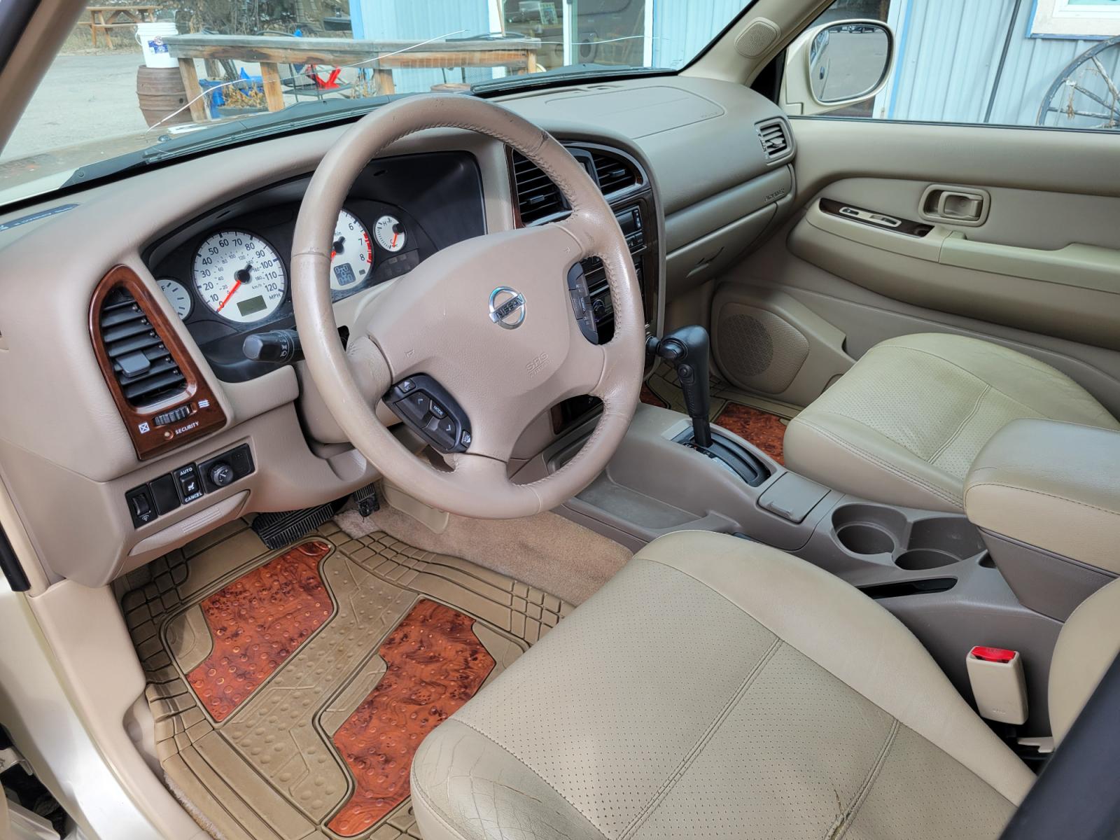 2002 Gold /Tan Nissan Pathfinder LE (JN8DR09Y22W) with an 3.5L v6 engine, Automatic transmission, located at 450 N Russell, Missoula, MT, 59801, (406) 543-6600, 46.874496, -114.017433 - 4WD SUV. 3.5L V6. Automatic Transmission. Heated Seats. Power Leather Seats. Power Sunroof. Air. Cruise. Tilt. AM FM CD Player. Power Windows and Locks. Because of the age, Financing is not available on this vehicle. - Photo #12